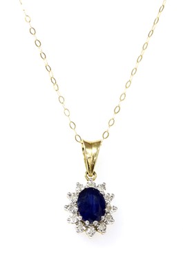 Lot 143 - A gold sapphire and diamond cluster pendant