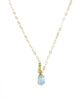 Lot 201 - A gold synthetic opal and diamond pendant