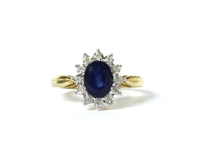 Lot 145 - A gold sapphire and diamond cluster ring