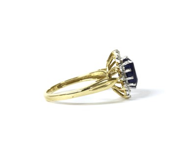 Lot 145 - A gold sapphire and diamond cluster ring