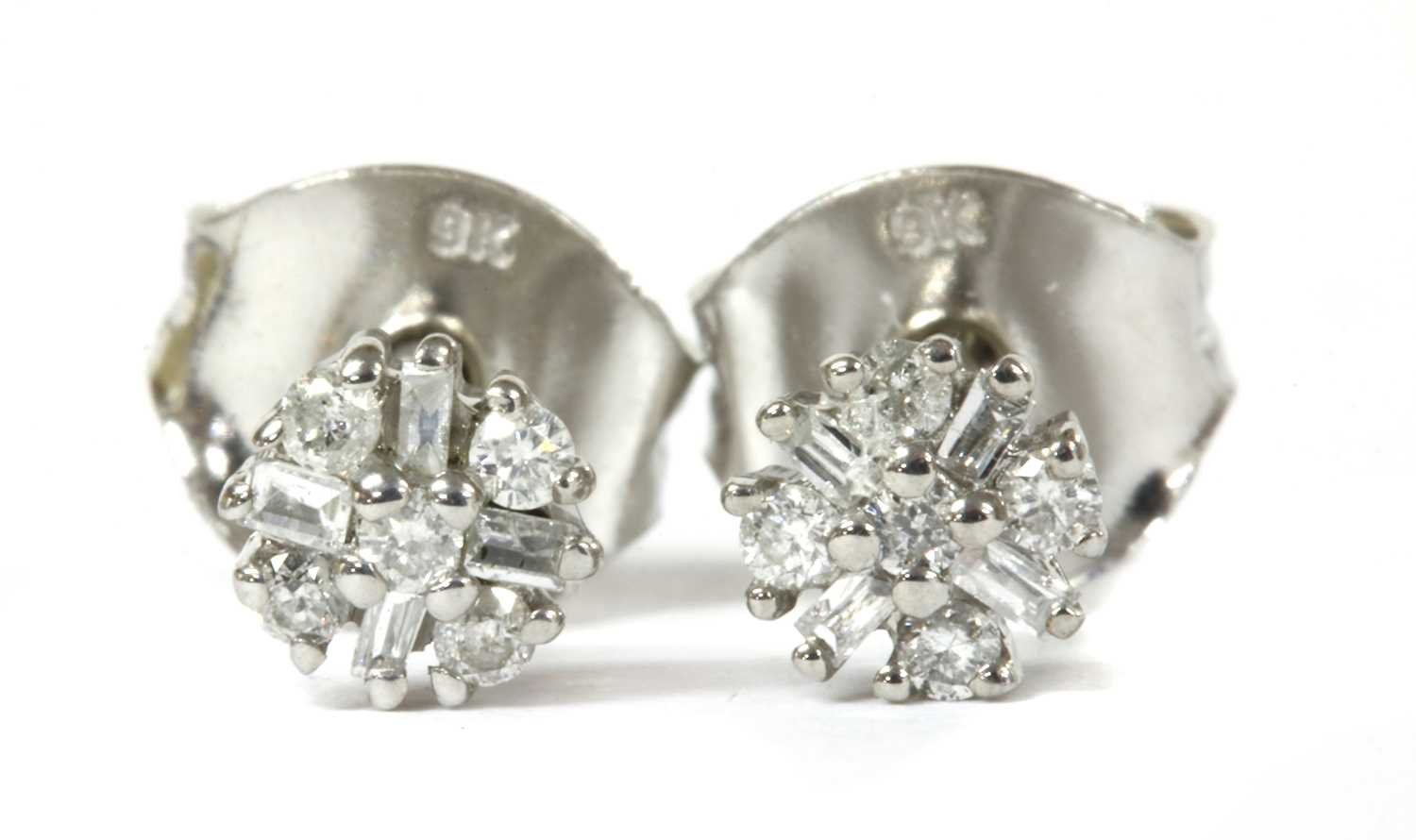 Lot 87 - A pair of white gold diamond cluster stud earrings