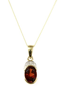 Lot 188 - A gold garnet and diamond pendant