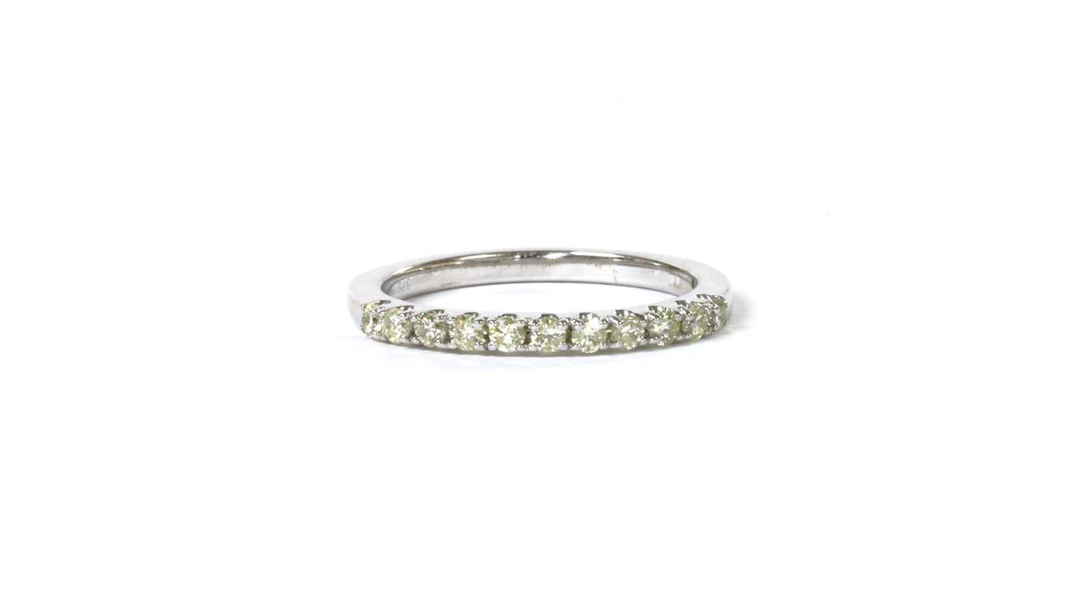 Lot 71 - A 9ct white gold diamond half eternity ring