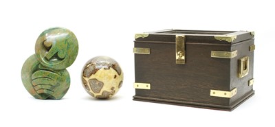 Lot 39 - A decorative stone orb and an African greenstone sculpture