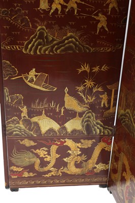 Lot 970 - A large Chinese six-fold red-lacquered screen