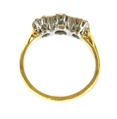 Lot 45 - A gold three stone diamond ring