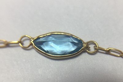 Lot 207 - A gold blue topaz rivière necklace
