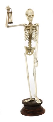 Lot 770 - A carved bone and ivory figure of a skeleton