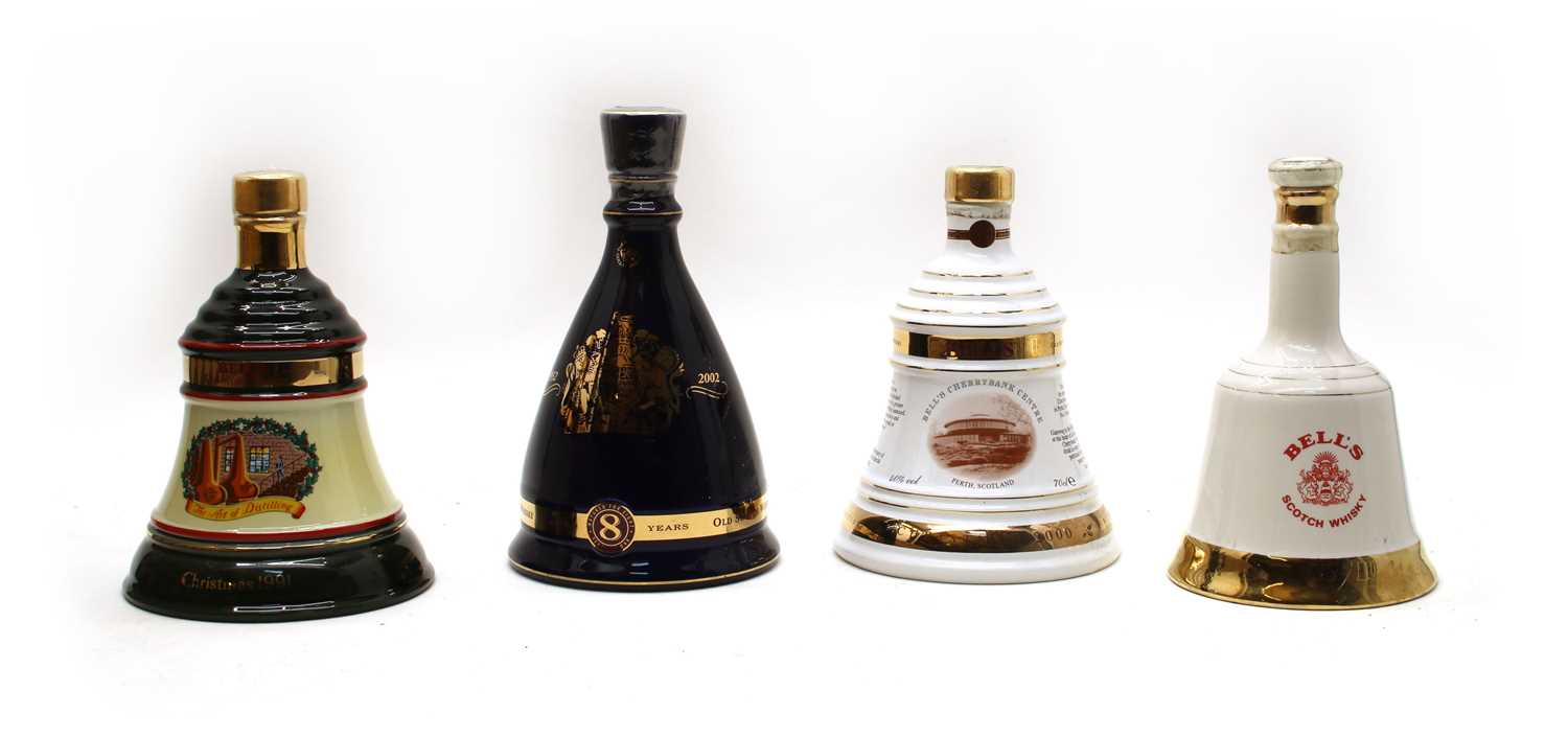 Lot 102 - Bells assorted commemorative whisky decanters of various size
