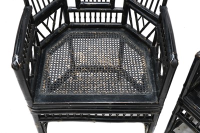Lot 943 - A pair of 'Brighton Pavilion' ebonised bamboo elbow chairs