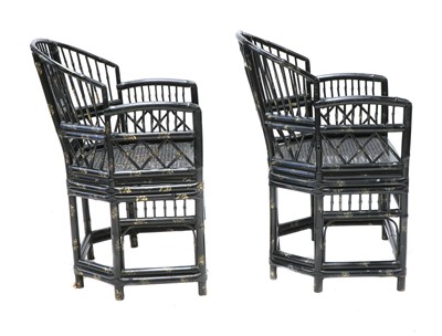 Lot 943 - A pair of 'Brighton Pavilion' ebonised bamboo elbow chairs