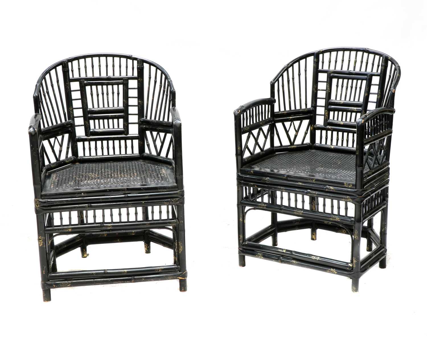 Lot 943 - A pair of 'Brighton Pavilion' ebonised bamboo elbow chairs