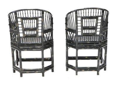 Lot 943 - A pair of 'Brighton Pavilion' ebonised bamboo elbow chairs