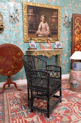 Lot 943 - A pair of 'Brighton Pavilion' ebonised bamboo elbow chairs
