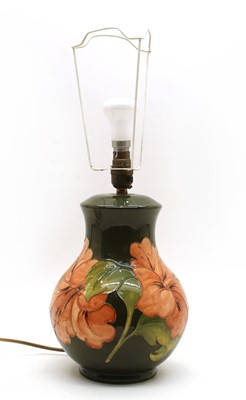 Lot 48 - A Moorcroft tubeline decorated 'Hibiscus' pattern table lamp