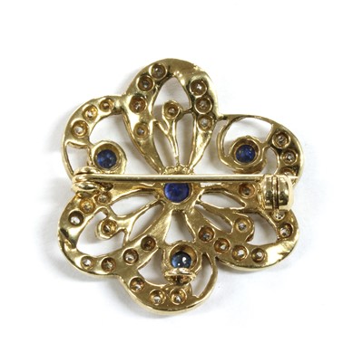 Lot 141 - A 9ct gold sapphire and diamond brooch