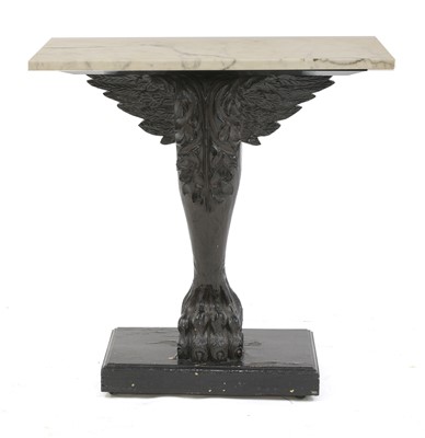 Lot 629 - A Greek Revival carved and ebonised console table