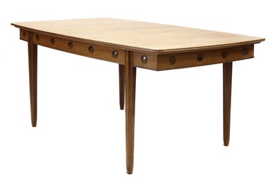 Lot 394 - A Gordon Russell fiddleback mahogany dining table
