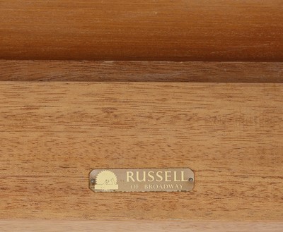 Lot 394 - A Gordon Russell fiddleback mahogany dining table