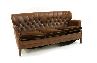 Lot 224 - An early 20th century brown leather button back settee