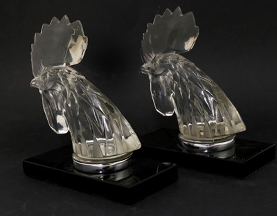 Lot 144 - A pair of Lalique 'Tete de Coq' car mascots