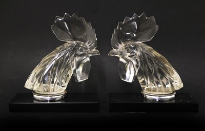 Lot 144 - A pair of Lalique 'Tete de Coq' car mascots