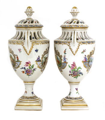 Lot 92 - A pair of Dresden urn vases and covers