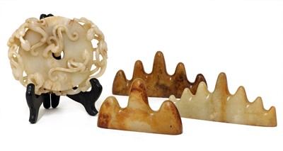 Lot 255 - A collection of three Chinese jade brush rests