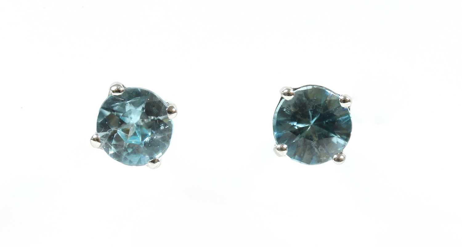 Lot 156 - A pair of white gold blue zircon stud earrings