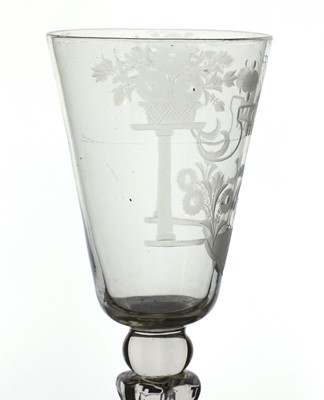 Lot 882 - An engraved glass goblet