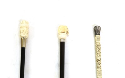 Lot 149 - Three Ivory topped walking canes