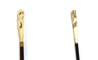 Lot 146 - A Japanese carved ivory handled walking cane