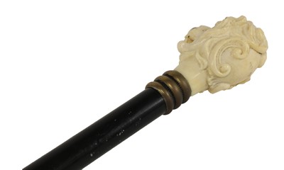 Lot 79 - A carved ivory and ebonised walking stick