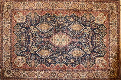 Lot 322 - A Persian blue ground carpet