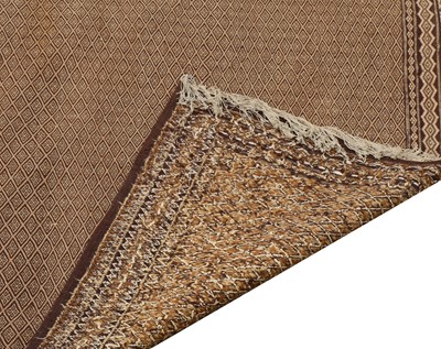 Lot 504 - A woven rug