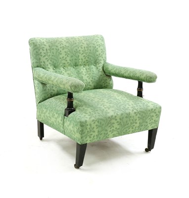 Lot 320 - A Howard style ebonised armchair