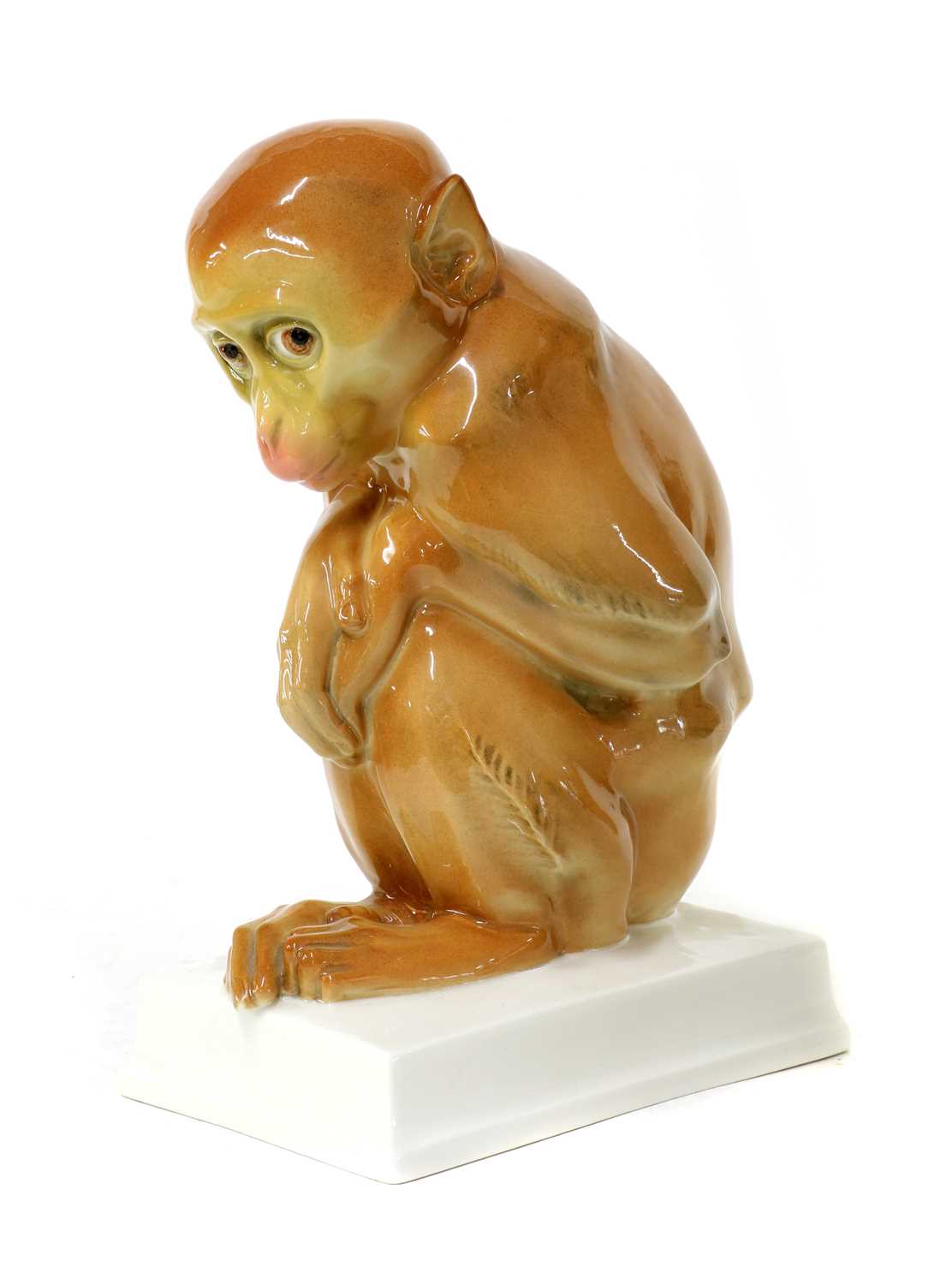 Lot 104 - A porcelain figure of a monkey