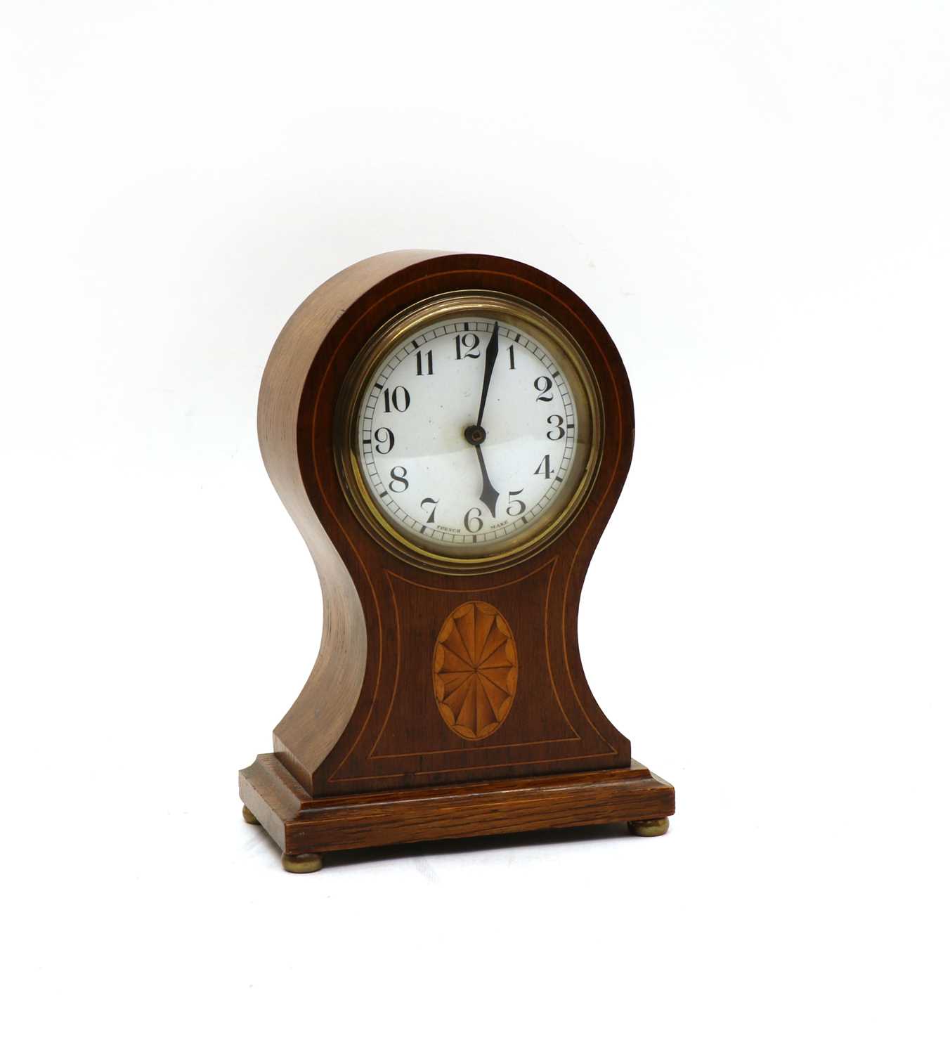 Lot 46 - An Edwardian mantel clock and an oak tray