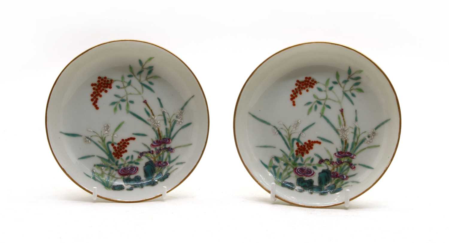 Lot 106 - A pair of Chinese famille rose saucers