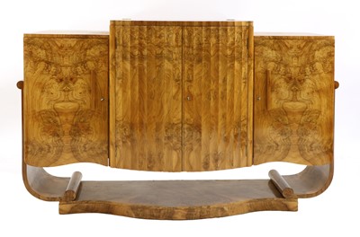 Lot 220 - An Art Deco burr walnut serpentine sideboard