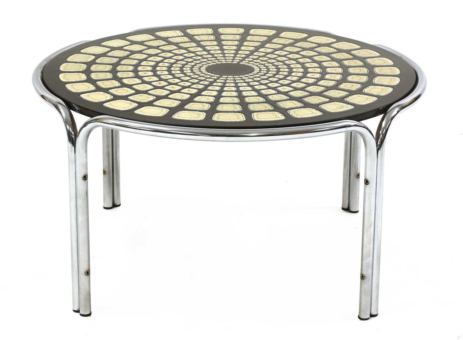 Lot 512 - A circular chrome table