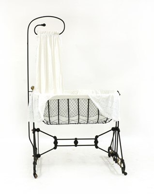 Lot 453 - A Victorian style wrought iron and brass crib