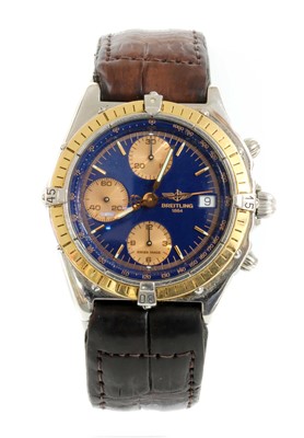 Lot 474 - A gentlemen's bi-colour Breitling automatic chronograph strap watch