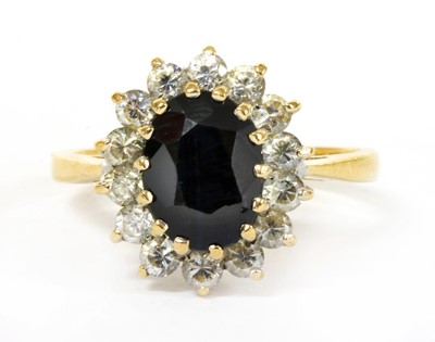 Lot 144 - A 9ct gold sapphire and diamond cluster ring
