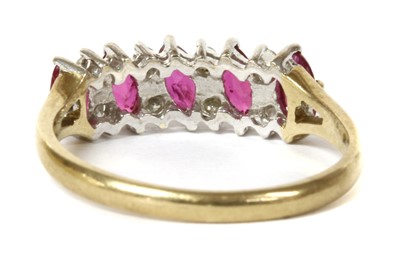 Lot 109 - A 9ct gold ruby and diamond half eternity ring