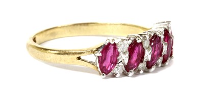 Lot 109 - A 9ct gold ruby and diamond half eternity ring