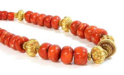 Lot 235 - A single row graduated coral and high carat gold bead necklace