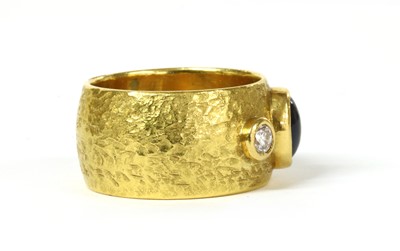 Lot 160 - A gold sapphire and diamond three stone band ring