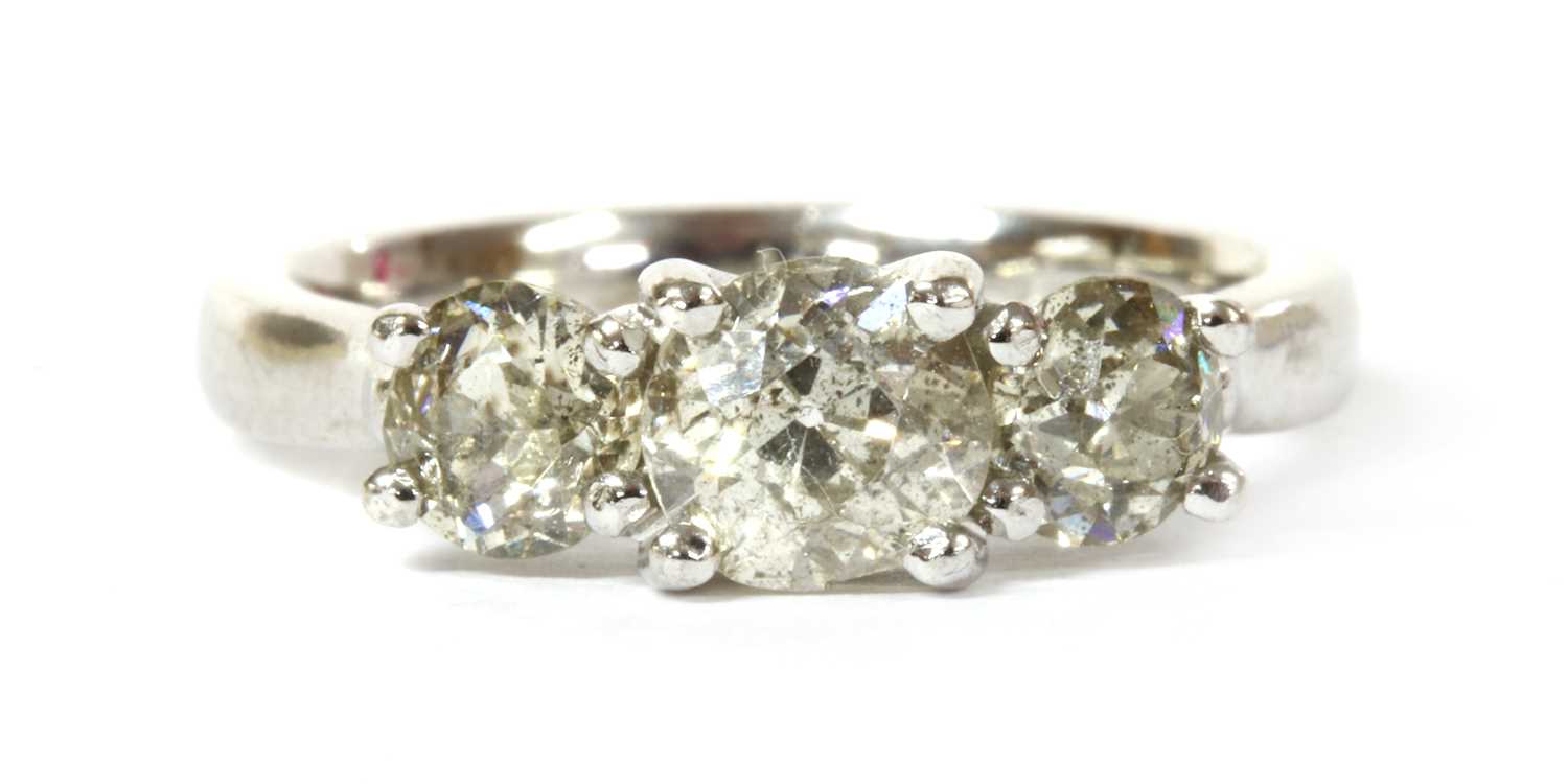 Lot 70 - An 18ct white gold three stone diamond ring