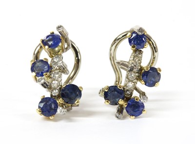 Lot 135 - A pair of two colour gold sapphire and diamond clip earrings